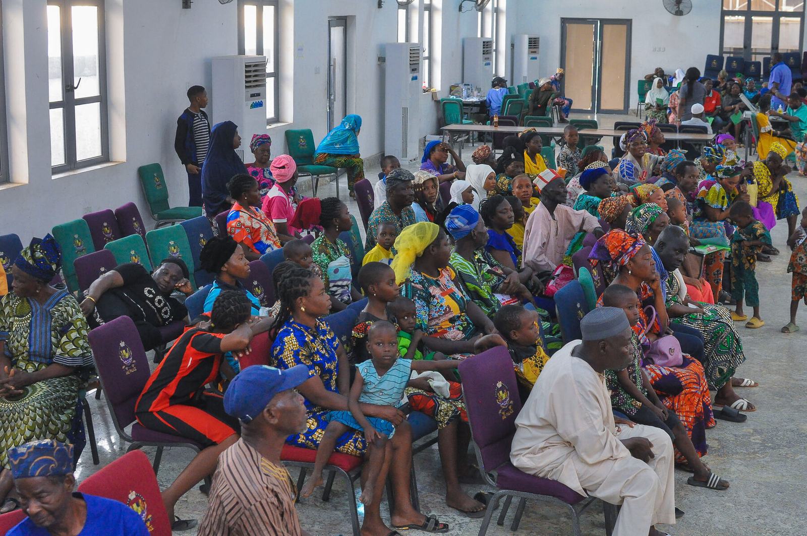 An audience of patients and families gathered at a Shekinah outreach
