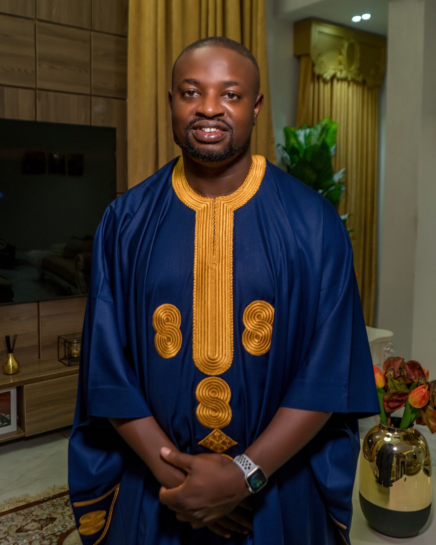 Dr. Adeboye in a navy and gold Nigerian traditional outfit